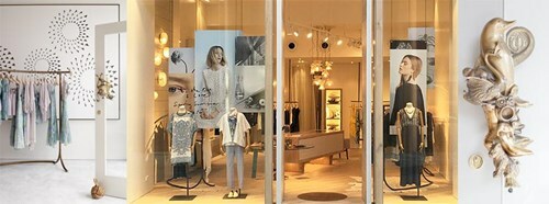 Entrance of Mega Park Fitzroy store with mannequins, clothing racks, and decorative wall art.