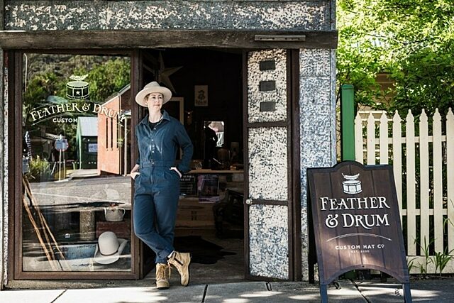 Entrance of Feather and Drum store open door, and sign reading 'Feather & Drum'.