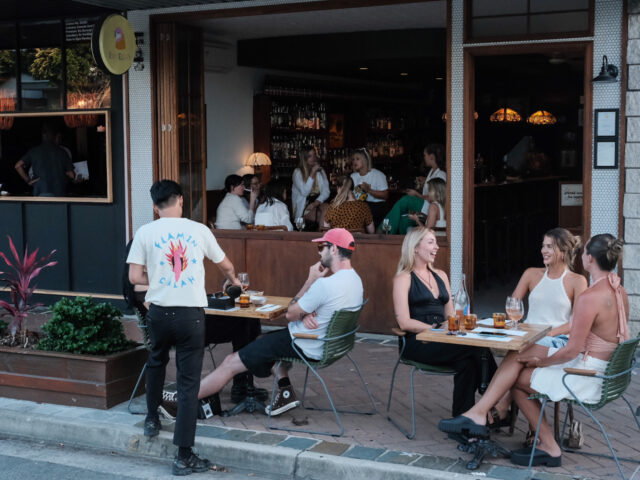 People sitting on chairs outside of Rosella's cafe